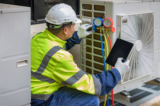 Professional Heat Pump Repair technician working in Yukon, OK